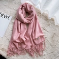 Soft light pink faux cashmere scarf with fringe edges on a plush beige background - Baby Pink