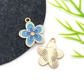 Detail of blue flower enamel pendants with golden base and radial textured back for DIY - Drip Oil Blue Four-Color Five-Petal Flower
