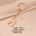 Rose gold envelope pendant keychain with blank tag on pink silk background - Rose Gold Keychain