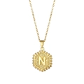 Golden hexagonal necklace with letter N pendant and beaded edge detail on a fine chain - Letter N