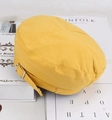 Classic yellow cotton twill newsboy cap with silver buckle on vintage books background - One Size 58cm / Yellow Fabric Style