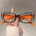 Cat-eye blue light glasses with black frames and vibrant orange temples in hand - Black Frame Orange Legs White Orange Lines