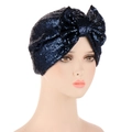Detailed view of deep blue sequins and a large bow on the women's turban hat - Navy Blue