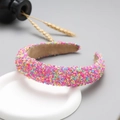 Close-up of wide glitter headband with colorful sprinkles and sweet stylish design - Rose Gold Rainbow