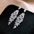 Macro shot of silver feather leaf drop earrings with sparkling marquise zircons - Silver Wheat Ear Feather Style (WE2033)