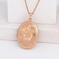 Rose gold oval locket necklace featuring detailed floral engraving on marble base - Oval Peach Blossom/Rose Gold