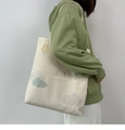 Detail of minimalist canvas tote bag with artistic hot air balloon print and text - Hot Air Balloon Beige
