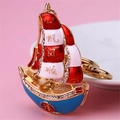 Golden sailboat keychain with red enamel sails and crystals for good fortune - Single OPP Bag Packaging / Fu Character Sailboat