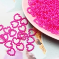 Dettaglio di perline ABS rosa a forma di cuore per nail art e decorazioni fai-da-te - Rosa Rossa