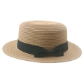 Classic summer straw boater hat with a chic black ribbon bow on white background - Khaki