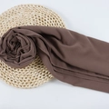 Brown chiffon hijab scarf with pearl accents on a natural woven mat background - 124