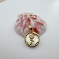 Detail of 18K gold-plated round pendant featuring a 3D rose on white mother of pearl - Gold Round Rose (White Shell)