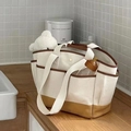 Large canvas mommy tote bag with brown trim and multi-pocket storage for baby essentials - White