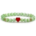 Green cat eye beaded bracelet with red enamel heart pendant and gold accents on white base - Green Red