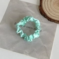 Elegant mint green satin scrunchie with pleated texture for hair styling accessories - Solid Cyan