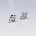 Macro detail of fan-shaped stud earrings with rectangular and round cubic zirconia stones - Single Fan
