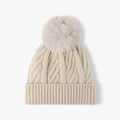 Winter knit beanie in cream white with a large grey faux fur pompom and cable knit pattern - One Size / Beige