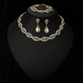 Detailed view of elegant jewelry set with champagne gemstones on a black bust mannequin - Gold Champagne 3-Piece Set (778)