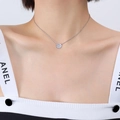 Silver chain necklace with a round hollow geometric pendant shown on a model neck - Steel Color Necklace (40+5cm)