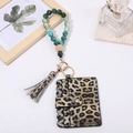 Detail of leopard print card holder with turquoise wood beads and tassel wristlet keychain - Green & White Leopard