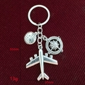 Travel themed metal keychain featuring silver airplane, globe, and compass charms - 6# (Airplane+Globe+Compass)