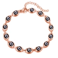 Detailed close-up of rose gold evil eye bracelet with blue enamel links and lobster clasp - Rose Gold Black