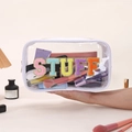 Detail of waterproof clear PVC pouch featuring colorful chenille STUFF letter patches - White (STUFF)