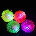 Glowing spiky soft rubber balls for kids in neon orange, green, blue, and purple set - 7.5CM Glowing Massage Ball