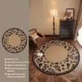 Vintage beige round rug with black floral patterns in a retro French living room setup - Diameter 80cm / Hidden Garden