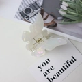 Elegant white pearlescent butterfly hair claw clip with a shimmering acetate finish - Iridescent White