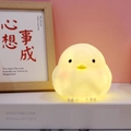Warm glowing yellow chicken night light made of soft silicone for home nursery decor - Small Bird Night Light