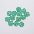 Macro detail of square 9.5mm green resin glitter druzy cabochons for DIY jewelry making - Color 2 (Green)