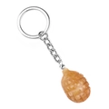 Mini grenade-shaped keychain pendant carved in vibrant orange natural stone texture - Yellow Jade