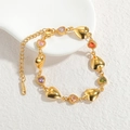 Bracciale a cuore in acciaio dorato con pietre colorate e chiusura a moschettone regolabile - Cuore / Oro