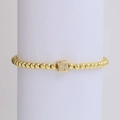 18k gold plated beaded elastic bracelet featuring a cube charm with rhinestone letter J - Letter J