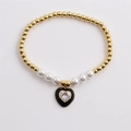 Elegante bracciale di perline dorate con perle bianche e ciondolo a cuore in zircone - Nero