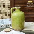 Vintage grüne Keramikvase mit Rissglasur und Henkel, 23 cm Höhe, rustikaler Boden - Grasgrüne runde Craquelé-Vase