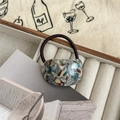 Close-up of marble pattern resin accessory on high elasticity black hair tie in a jewelry box - Marble / Light Blue Oil Painting