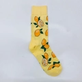Detail of bright yellow crew socks featuring lemon patterns and ribbed elastic cuffs - One Size / Lemon