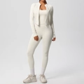 Detailed close-up of beige 3-piece yoga set with zip-up jacket, camisole, and leggings - Light Ivory
