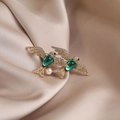 Elegant gold alloy brooch with white crystals and green gemstones in a twin bird design - 536# Lovebirds