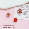 Detailed macro of 9x12mm gold-plated pomegranate charms for DIY jewelry making - Half Open Pomegranate