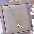 3D polished golden bear pendant necklace in titanium steel on a grey jewelry display box - Gold