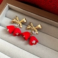 Macro detail of red velvet bell flower earrings with golden bows and pearls - Gold Red Bowknot Flower Style (HE12682)