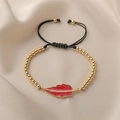 Adjustable woven bracelet featuring gold beads and a red enamel leaf pendant with zircons - Hot Pink