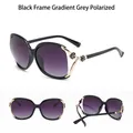 Polarized oversized women's sunglasses in black frame with golden camellia flower hinge - Polarized Glossy Black Frame Gradient Grey Lens