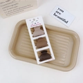 Detailed macro view of three coffee-colored matte resin mini hair claws on a card - 3Pcs Claw Clip Set-Semi-circle Shape / Coffee Brown Series