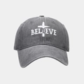 Close-up of white BELIEVE text and cross embroidery on vintage dark grey baseball cap - Gray