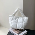 Minimalist white quilted puffer handbag with soft padded texture and top handles - White