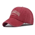 Close-up of vintage red washed cotton baseball cap with white Los Angeles embroidery - Washed Watermelon Red